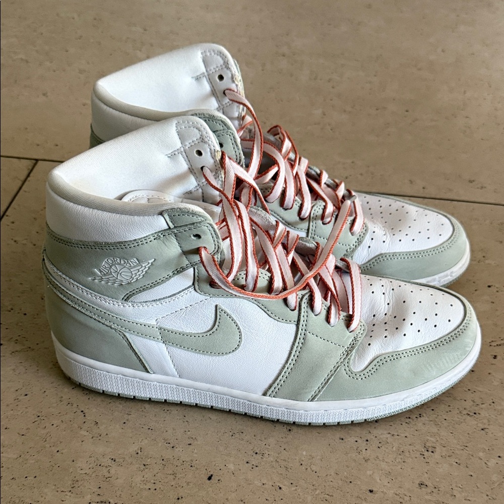 Men’s 10.5 or women’s 12 Nike Jordan 1 high top sneakers